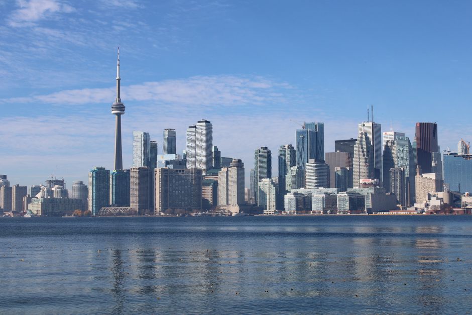 Tenant reviewing Ontario standard lease at kitchen table