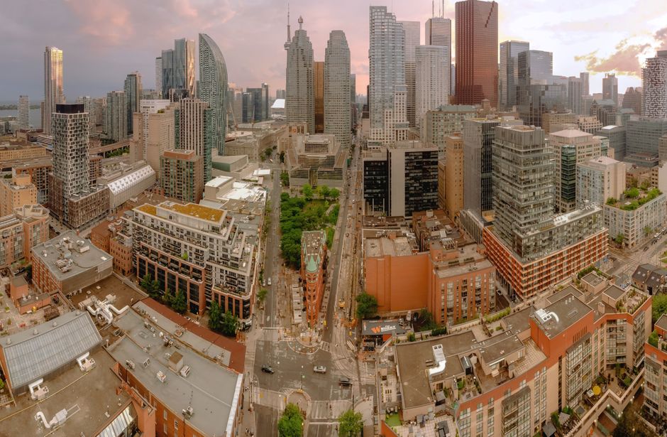 Multiplex and fourplex zoning reform: Ontario neighbourhood streetscape with potential small multiplex buildings.