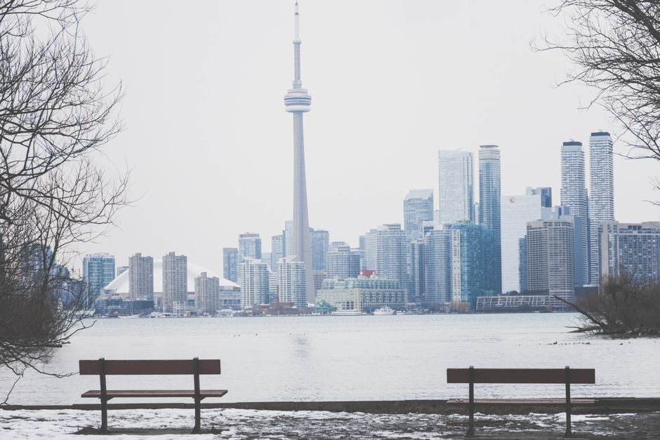 Toronto landlord reviewing rent ledger and notices